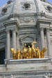 Gold Progress of the State equestrian statues on dome of Minnesota State Capitol. St. Paul, MN.