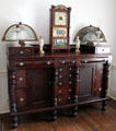 Sideboard with clock & fans at General Daniel Bissell House. St. Louis, MO.