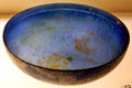 Shallow blue glass Greek or Roman bowl from Syria or Palestine at University of Missouri Museum of Art & Archaeology. Columbia, MO.