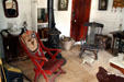 Rocking chairs & stove of Pioneer Cabin at Reeder's Alley. Helena, MT.