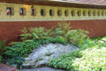 Concrete window frames on wall integrated with boulder at Zimmerman House. Manchester, NH.