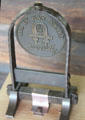 Als ik kan award shows phase meaning 'everything that I able to do' originated by Dutch painter Jan van Eyck centered in sketch of cooper's compass over Gustav Stickley's signature at Stickley Museum. The monogram was Stickley's company logo. Morris Plains, NJ.