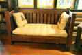 Arts & Crafts oak vertical board settle plus cushions at Stickley Museum at Craftsman Farms. Morris Plains, NJ.