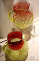 Rubina glass pitchers by Hobbs, Brockunier & Co. of Wheeling, WV at Museum of American Glass. Milville, NJ.