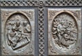 New head of the Franciscan missions arrives with Our Lady La Conquistadora Virgin Mary statue & church burns in Pueblo revolt on panels of St. Francis Cathedral bronze door. Santa Fe, NM.