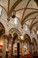 Aisles in St. Francis Cathedral with Clermont-Ferrand, France stained glass windows. Santa Fe, NM.