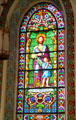 Evangelist St Matthew with angel stained glass window in St Francis Cathedral. Santa Fe, NM.