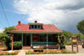 Gallery at 403 Canyon Road in heritage hip-roof house. Santa Fe, NM.