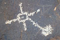 Petroglyph with cross at Petroglyph National Monument. Albuquerque, NM.