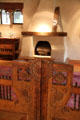 Carved swinging gate by Nicolai Fechin leading to living room at Taos Art Museum. Taos, NM.