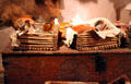 Glass bottles on carved chest at Hacienda de los Martinez. Taos, NM.