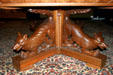 Table supported by carved foxes in Theodore Roosevelt Inaugural Site. Buffalo, NY.
