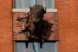 Sculpted buffalo emerges through facade of Rockwell Museum of Art. Corning, NY.
