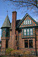 Brick Tudor heritage home in Ithaca's East Hill heritage district. Ithaca, NY.