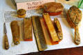 Arts & Crafts vanity set of nail file, shoe horn, comb, nail buffer, hair brush & boxes at Elbert Hubbard Roycroft Museum. East Aurora, NY.