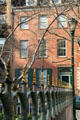Antique cast-iron fence with Stuyvesant-Fish House. New York, NY