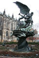 Peace Fountain by Greg Wyatt topped by Michael the Archangel casting out Satan in Children's Sculpture Garden. New York, NY.