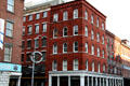 Heritage brick warehouse buildings at Front & Beekman Streets with 211 Front by George B. Post at center in South Street Seaport Heritage District. New York, NY.