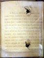 Roosevelt's folded speech with bullet hole which with glass cases slowed assassin's attempt at Theodore Roosevelt Birthplace. New York, NY.