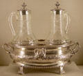 Silver cruet frame with later glass bottles from Paris, France at Metropolitan Museum of Art. New York, NY.