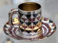 Silver, copper, niello cup & saucer by Tiffany & Co. of New York City at Metropolitan Museum of Art. New York, NY.
