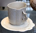 Porcelain flower grip cup & saucer made by Union Porcelain Works, Greenpoint, Brooklyn at Metropolitan Museum of Art. New York, NY.