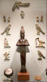 Statues & tiles of gods placed in tombs to protect deceased at Metropolitan Museum of Art. New York, NY.