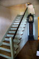Staircase with tall clock at Conference House. Staten Island, NY.