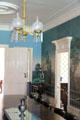 Wallpaper & lamp with folding card table in corner of dining room at Lindenwald. Kinderhook, NY.