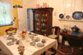 Dining table & vintage display cabinet at Home Sweet Home Museum. East Hampton, NY