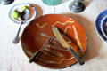 Table setting with knife & fork on redware plate at Thomas Halsey Homestead. South Hampton, NY.