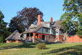 Queen Anne architecture of house at Sagamore Hill National Historic Site with octagonal ice house. Cove Neck, NY.