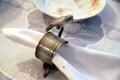 Ornate napkin holder with figure of bird in dining room at Ida Saxton McKinley Historic House. Canton, OH.