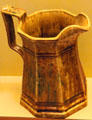 Rockingham paneled pitcher with brown, green & yellow glaze attrib. to James Bennett & Bros. at Museum of Ceramics. East Liverpool, OH.