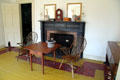 Parlor with fireplace, table & chairs in Jonathan Goldsmith House at Hale Farm. Cleveland, OH.