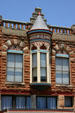 Native red sandstone plus blue & red trim details of De Steiguer building. Guthrie, OK.