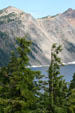 Trees against slopes of Crater Lake National Park. OR.