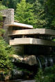 Fallingwater projects over a waterfall of Bear Run stream. Mill Run, PA.
