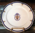 Monogrammed dinner plate made for John Wolfe of The Reefs, a Newport mansion destroyed by fire in 1942, at The Breakers. Newport, RI.
