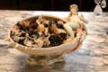 Ceramic bowl with reclining female figure on rim at Rosecliff. Newport, RI.