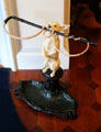 Umbrella stand in shape of dog holding whip at Chepstow. Newport, RI.