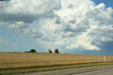 Clouds over old grain elevator. SD.
