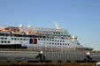Cruise ship Ecstacy above rail cars. Galveston, TX.