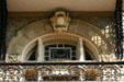 Bishop's Palace window arch with carvings & iron railings. Galveston, TX.