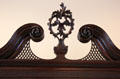 Detail of open swans-neck pediment & finial of High Chest of Drawers from Philadelphia at Bayou Bend. Houston, TX.
