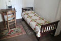 Bedroom with quilt at Kellum-Noble House at Sam Houston Park. Houston, TX.