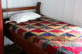 Bed with quilt at Nichols-Rice-Cherry House at Sam Houston Park. Houston, TX.