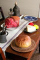 Kitchen table with food models in San Felipe Cottage at Sam Houston Park. Houston, TX.