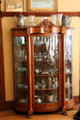 Vitrine with collection of glass & silver in Staiti House at Sam Houston Park. Houston, TX.