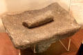 Corn grinding stone in museum at Mission San José. San Antonio, TX.